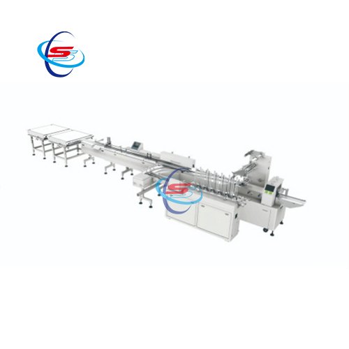 Packing machine with tray dispenser